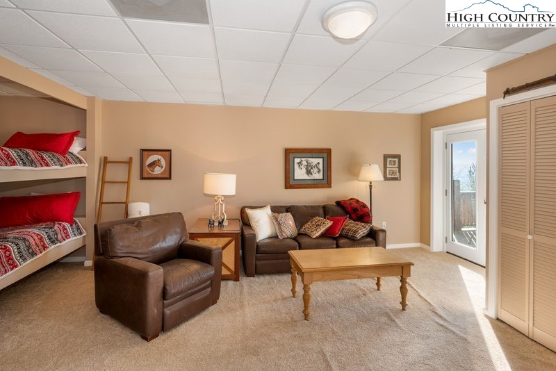 1155 Elk Ridge Road Ferguson, NC 28624 - Photo 35 of 46 a living room with furniture and a window