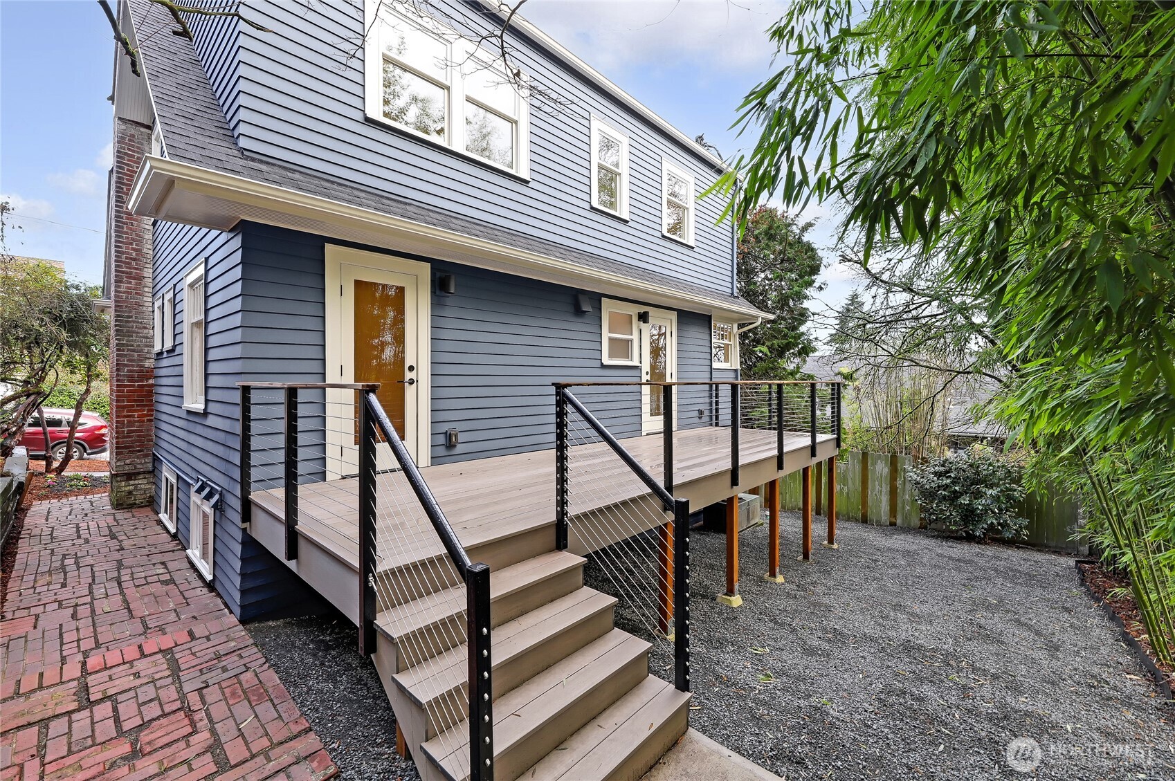 2207 East Republican Street Seattle, WA 98112 - Photo 22 of 24 a view of a house with backyard and sitting area