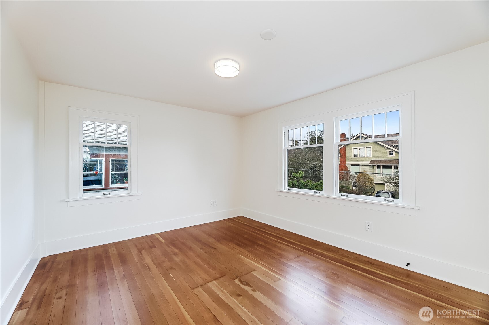 2207 East Republican Street Seattle, WA 98112 - Photo 8 of 24 an empty room with windows