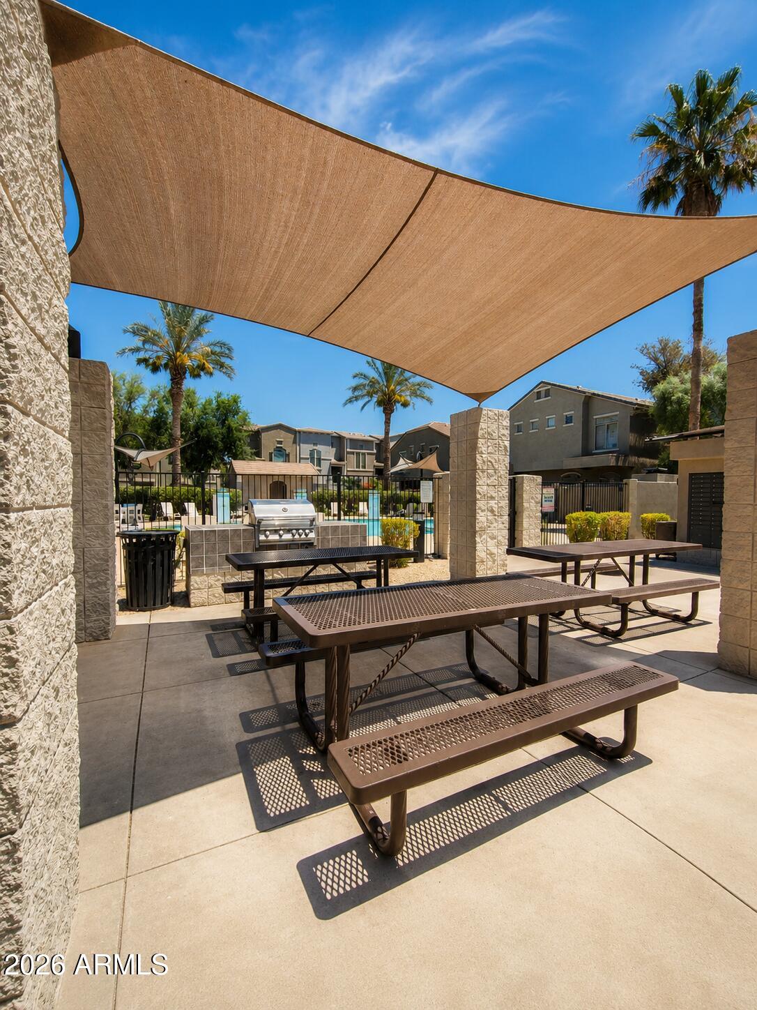 2150 West Alameda Road, Unit 1020 Phoenix, AZ 85085 - Photo 8 of 35 a living room with patio furniture and a potted plant