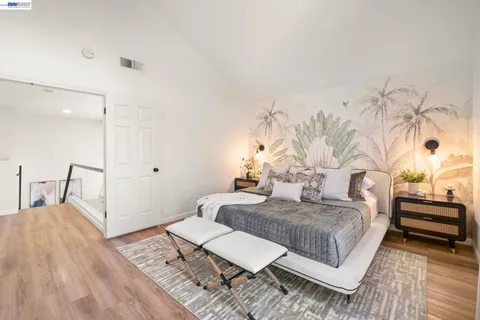 a bedroom with a bed and a table