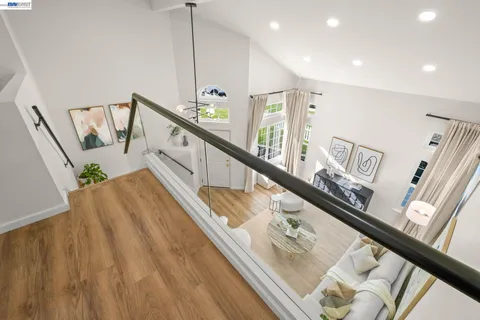 a view of a hallway with furniture and stairs