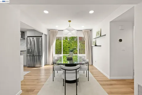 a dining room with furniture and window