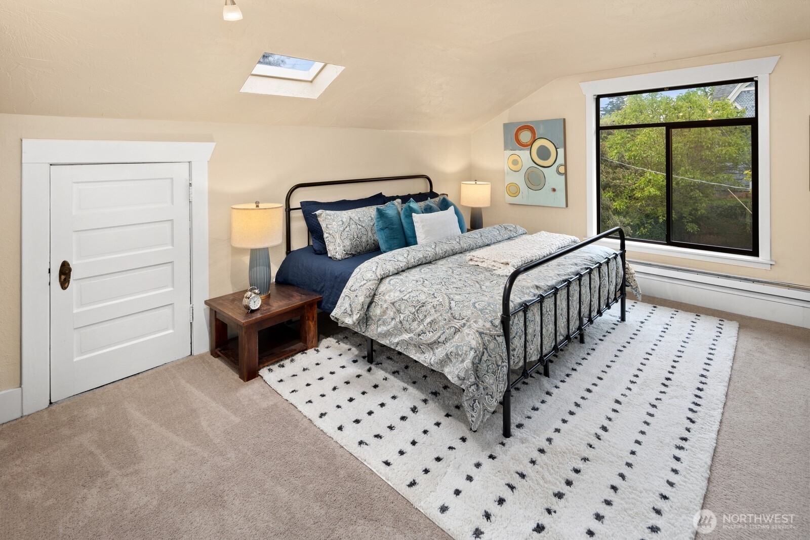 4522 3rd Avenue Northwest Seattle, WA 98107 - Photo 13 of 30 a bedroom with a bed and a window