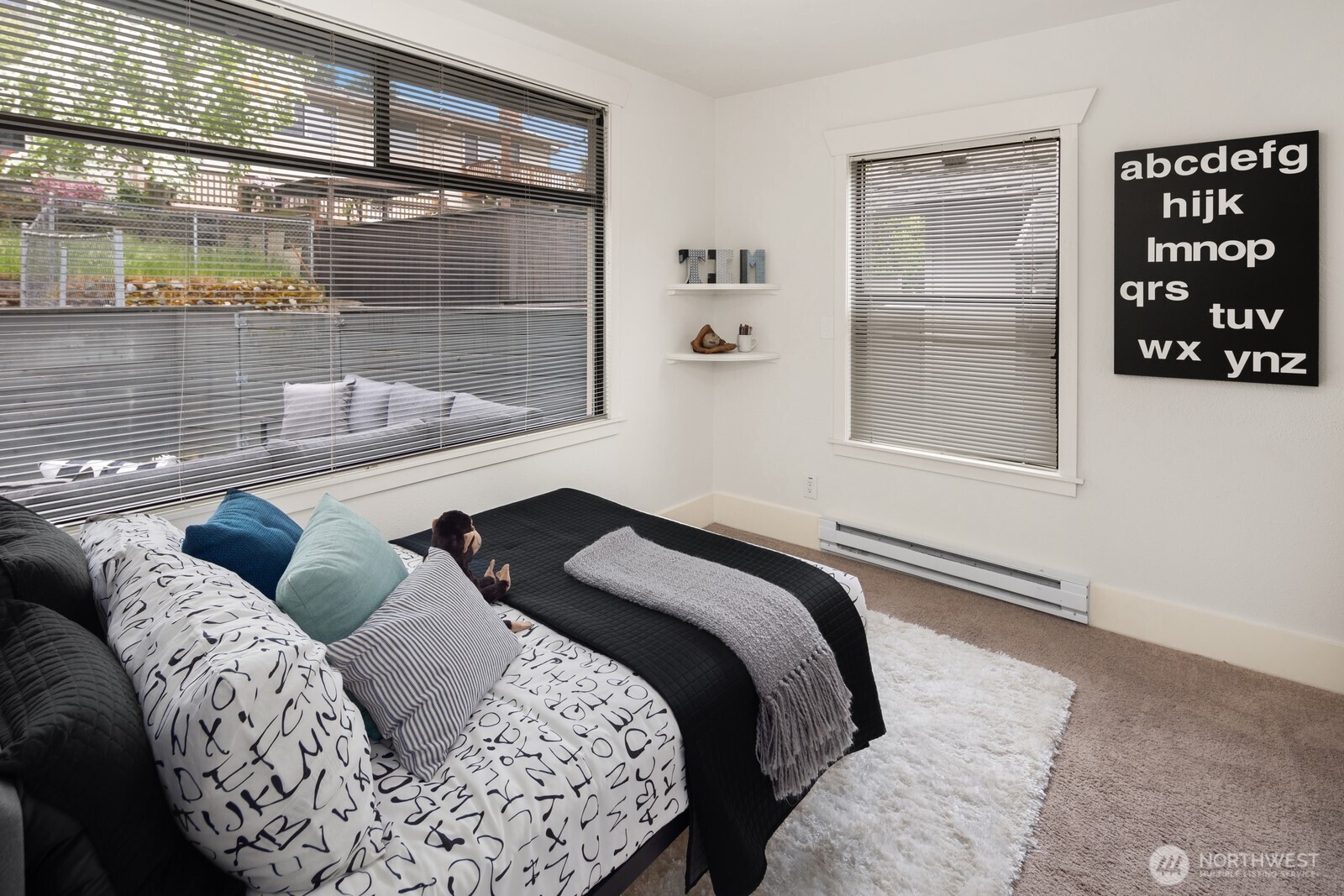 4522 3rd Avenue Northwest Seattle, WA 98107 - Photo 15 of 30 a bedroom with a bed and a window