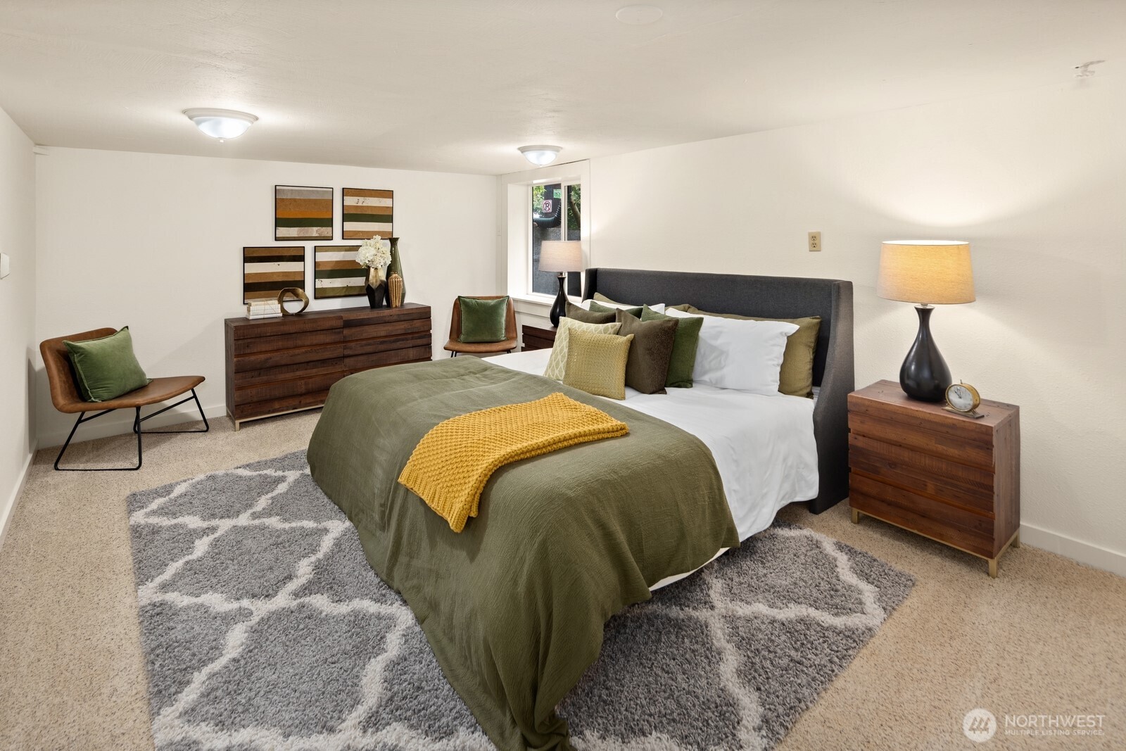 4522 3rd Avenue Northwest Seattle, WA 98107 - Photo 19 of 30 a bedroom with a bed and lamp