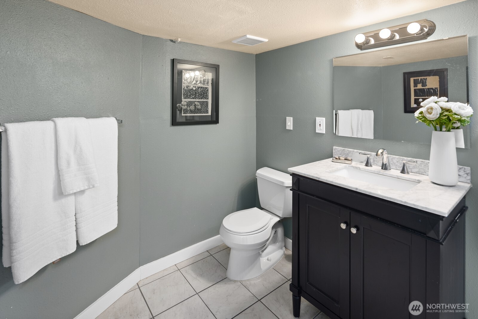 4522 3rd Avenue Northwest Seattle, WA 98107 - Photo 20 of 30 a bathroom with a sink toilet and mirror