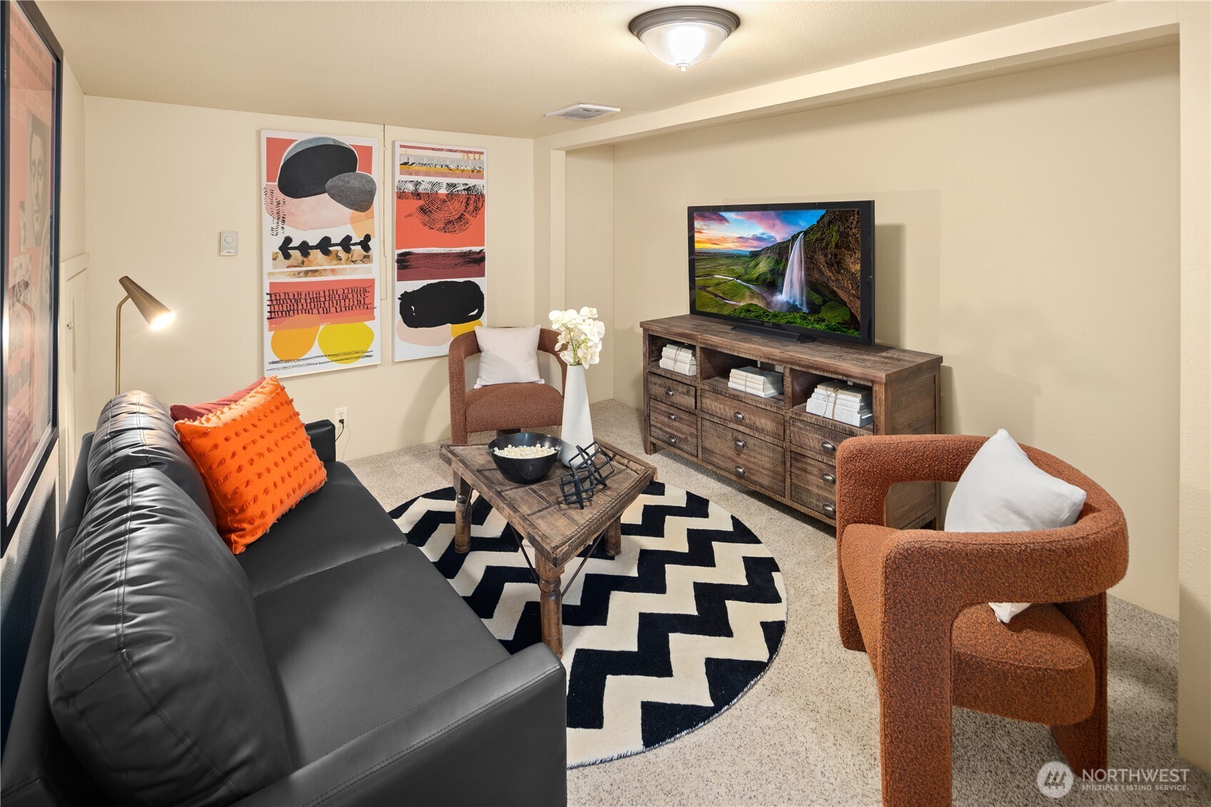 4522 3rd Avenue Northwest Seattle, WA 98107 - Photo 23 of 30 a living room with furniture and a flat screen tv
