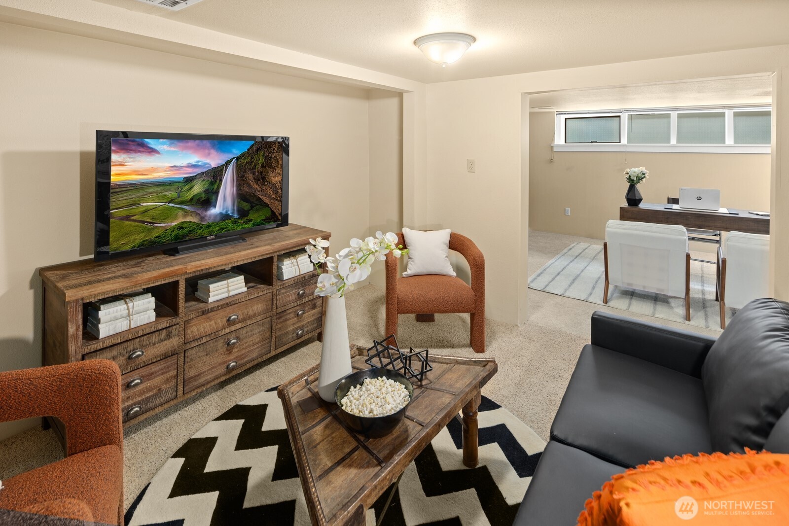 4522 3rd Avenue Northwest Seattle, WA 98107 - Photo 24 of 30 a living room with furniture and a flat screen tv