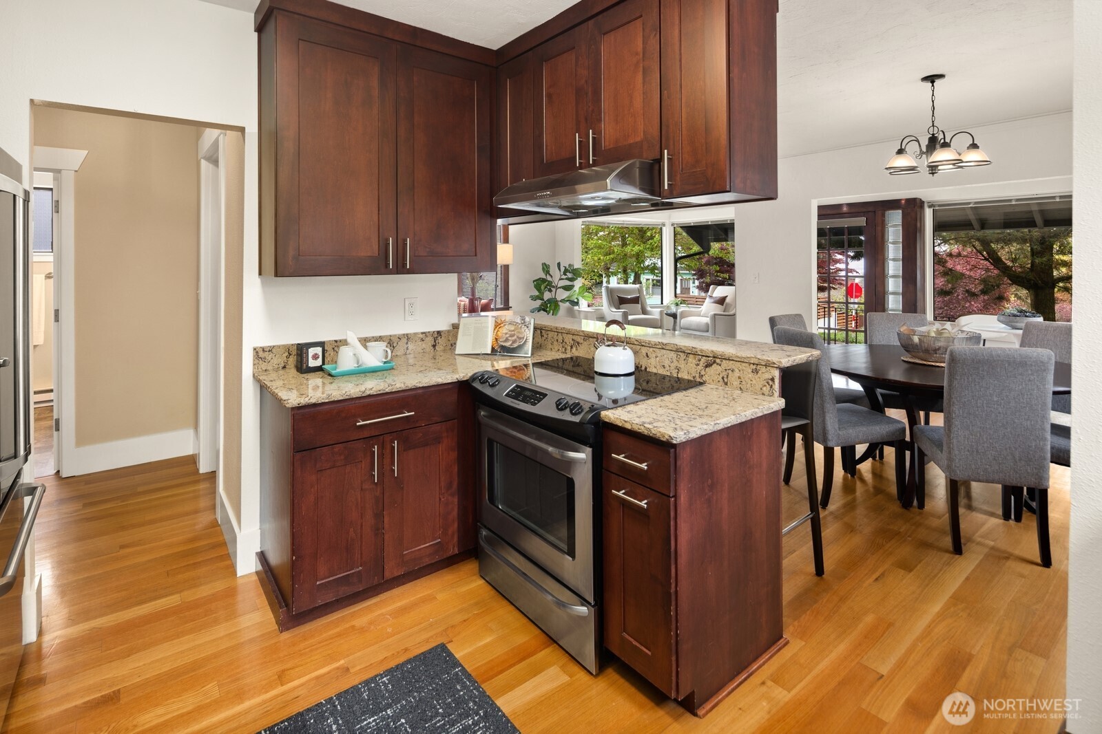 4522 3rd Avenue Northwest Seattle, WA 98107 - Photo 7 of 30 a kitchen with stainless steel appliances granite countertop a stove and a refrigerator