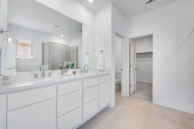 a bathroom with a tub and shower