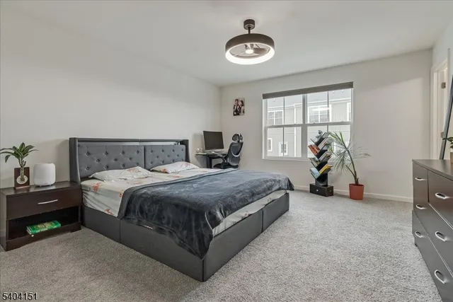 a bed room with a bed and a lamp