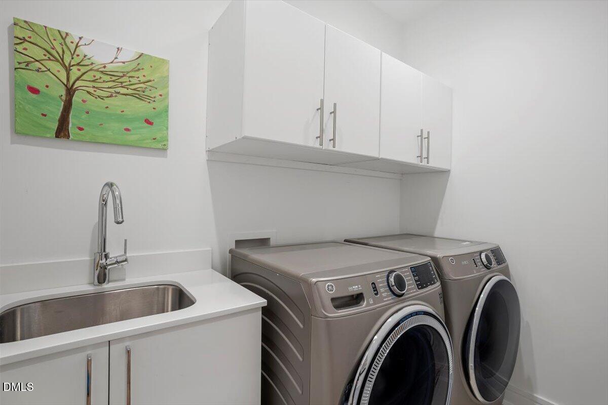 206 Dundas Lane Raleigh, NC 27603 - Photo 20 of 30 a utility room with dryer and washer