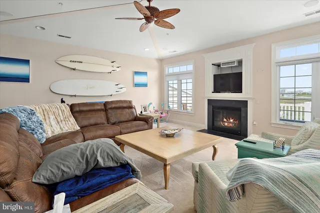 a view of a balcony with wooden chairs