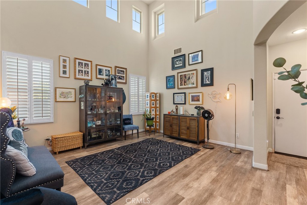 8553 Lodgepole Lane Riverside, CA 92508 - Photo 11 of 75 a living room with furniture and wooden floor
