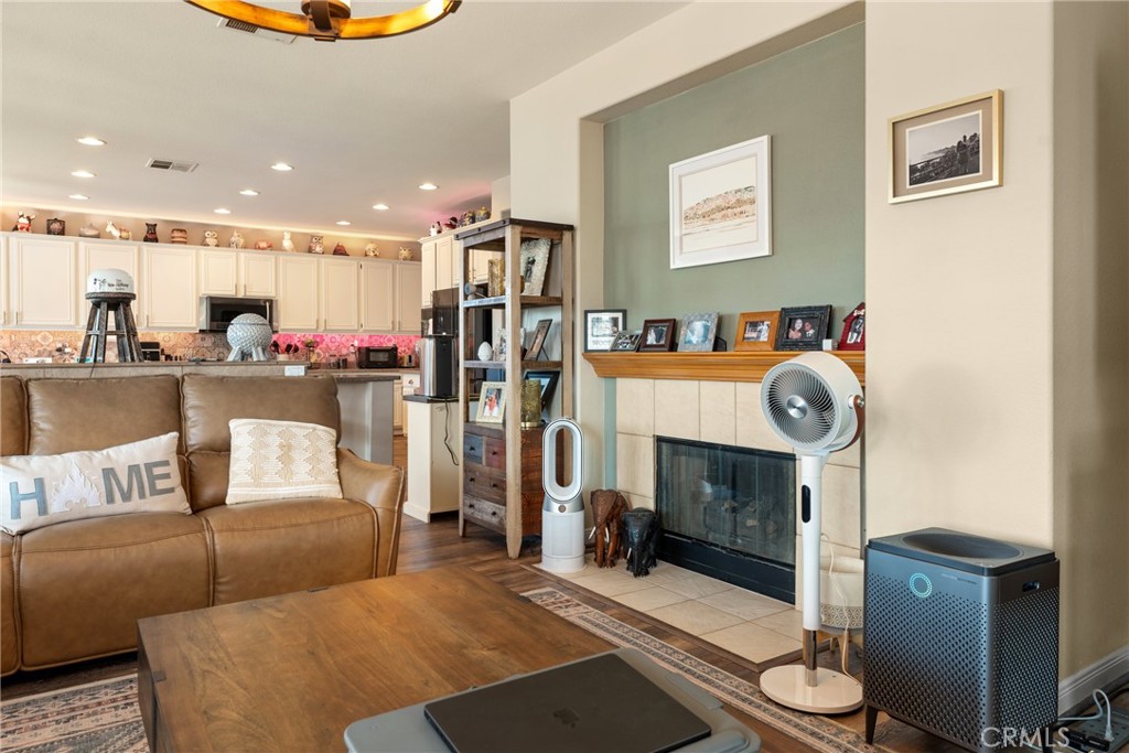 8553 Lodgepole Lane Riverside, CA 92508 - Photo 17 of 75 a living room with furniture and a fireplace