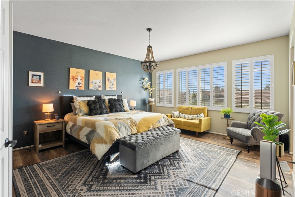 8553 Lodgepole Lane Riverside, CA 92508 - Photo 30 of 75 a bed room with a bed and a couch