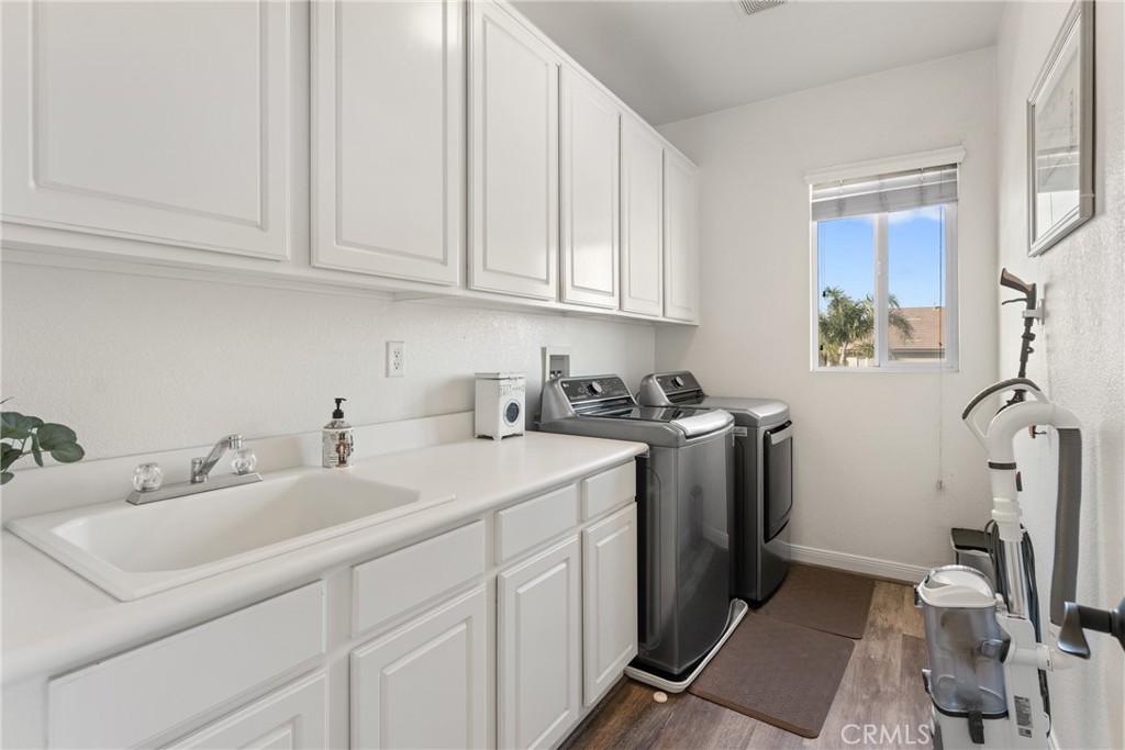 8553 Lodgepole Lane Riverside, CA 92508 - Photo 38 of 75 a utility room with sink dryer and washer
