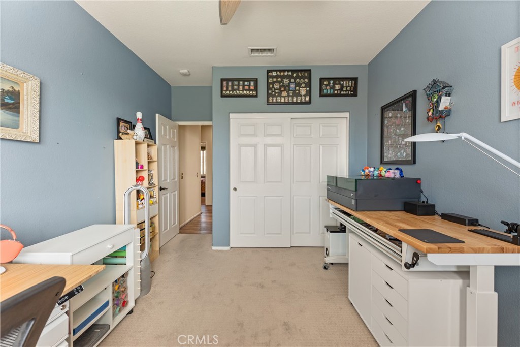 8553 Lodgepole Lane Riverside, CA 92508 - Photo 41 of 75 a bedroom with a bed and a desk