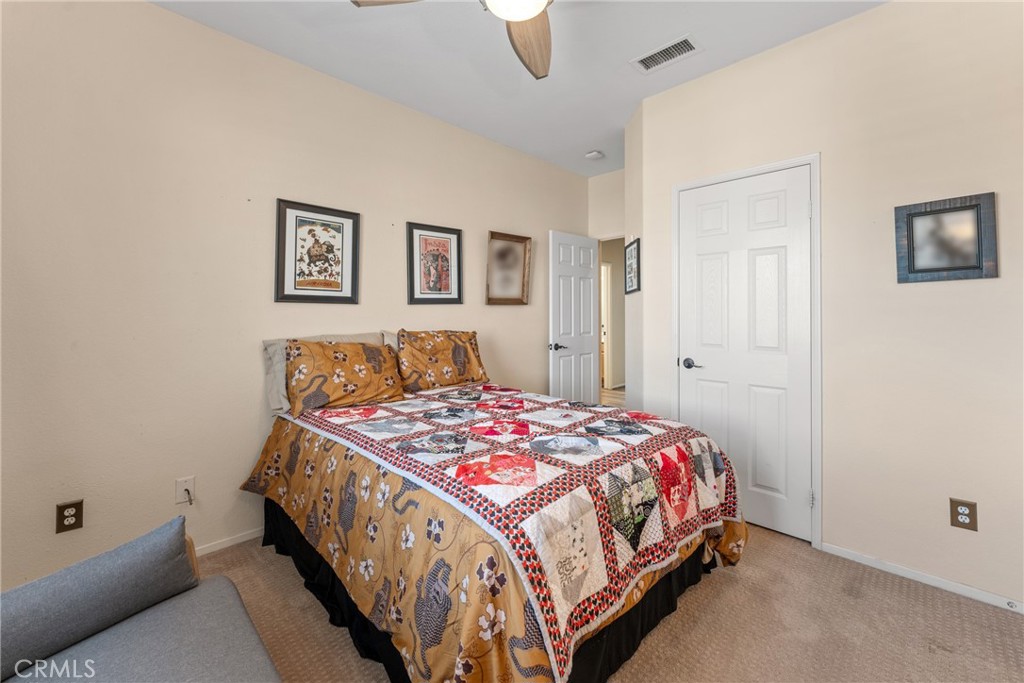 8553 Lodgepole Lane Riverside, CA 92508 - Photo 42 of 75 a bedroom with a bed and painting on the wall