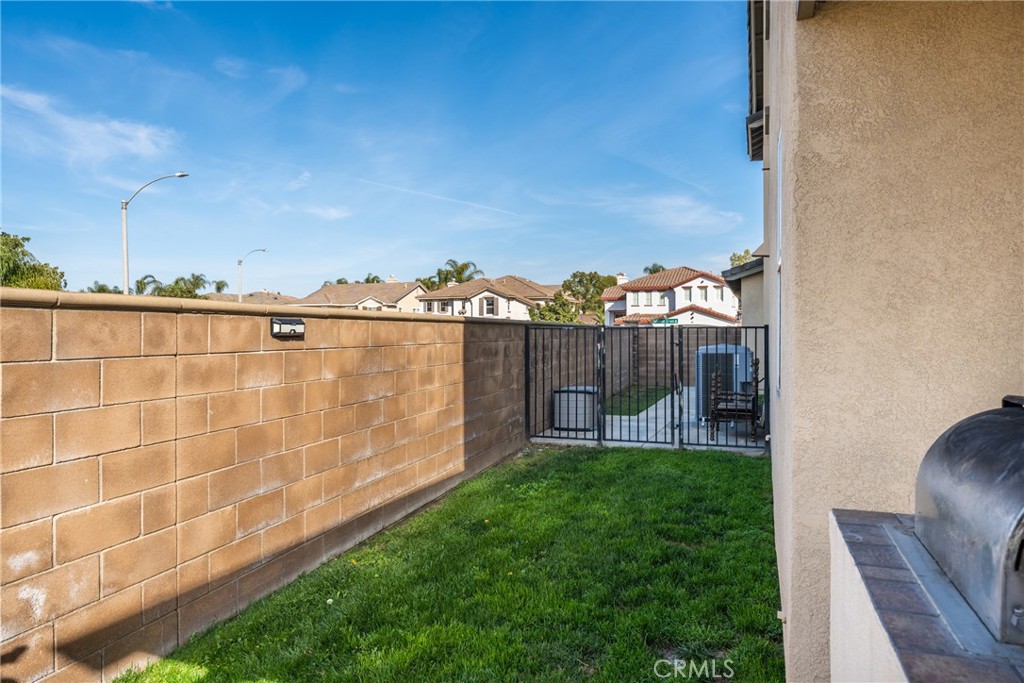 8553 Lodgepole Lane Riverside, CA 92508 - Photo 47 of 75 a view of a chair and table in the back yard