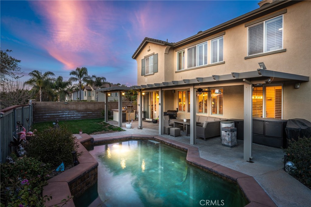 8553 Lodgepole Lane Riverside, CA 92508 - Photo 52 of 75 a view of a house with swimming pool and sitting area