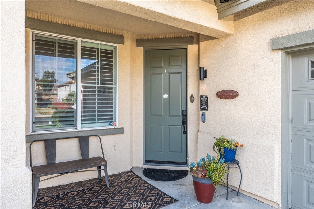 8553 Lodgepole Lane Riverside, CA 92508 - Photo 8 of 75 a front view of a house with potted plants