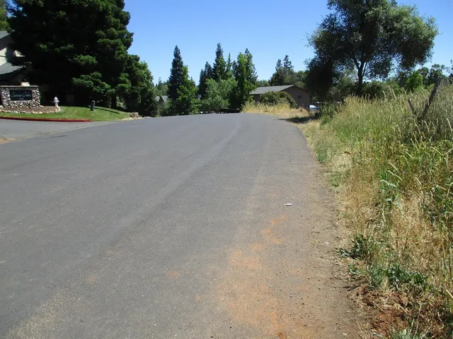 a view of a road with a yard