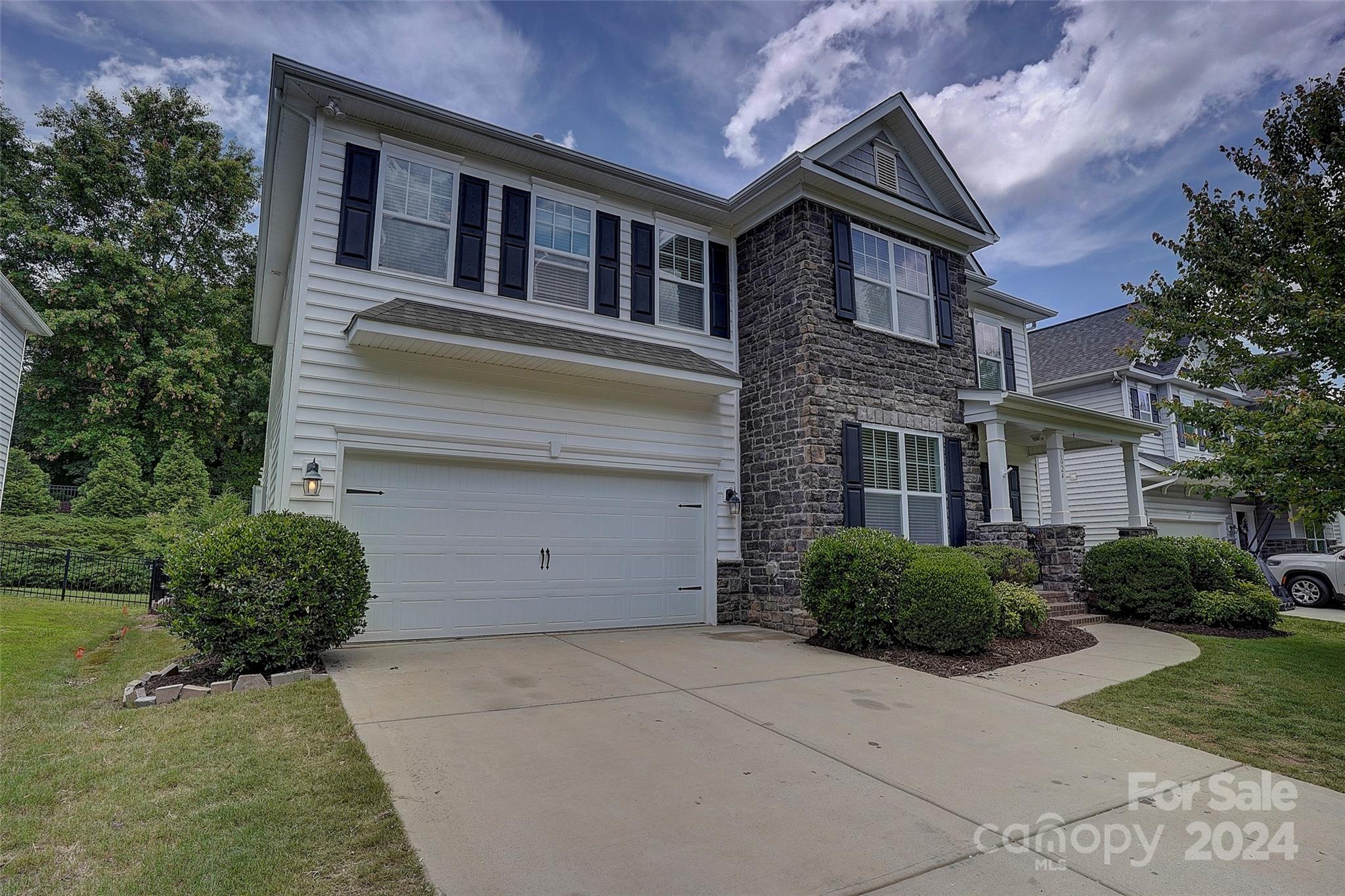 a house view with a garden space