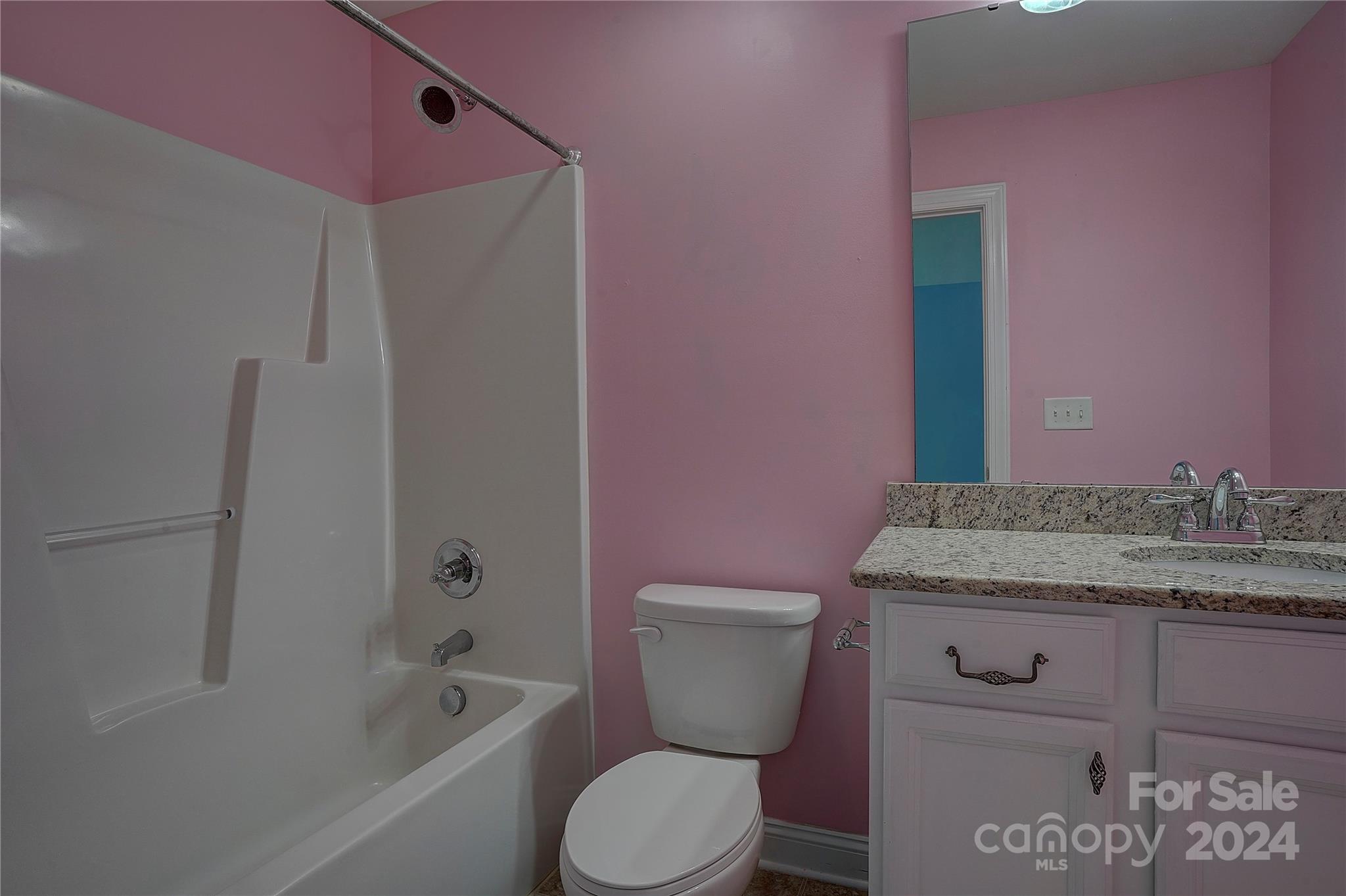 1024 Ridgehaven Road Waxhaw, NC 28173 - Photo 20 of 36 a bathroom with a granite countertop toilet sink and mirror