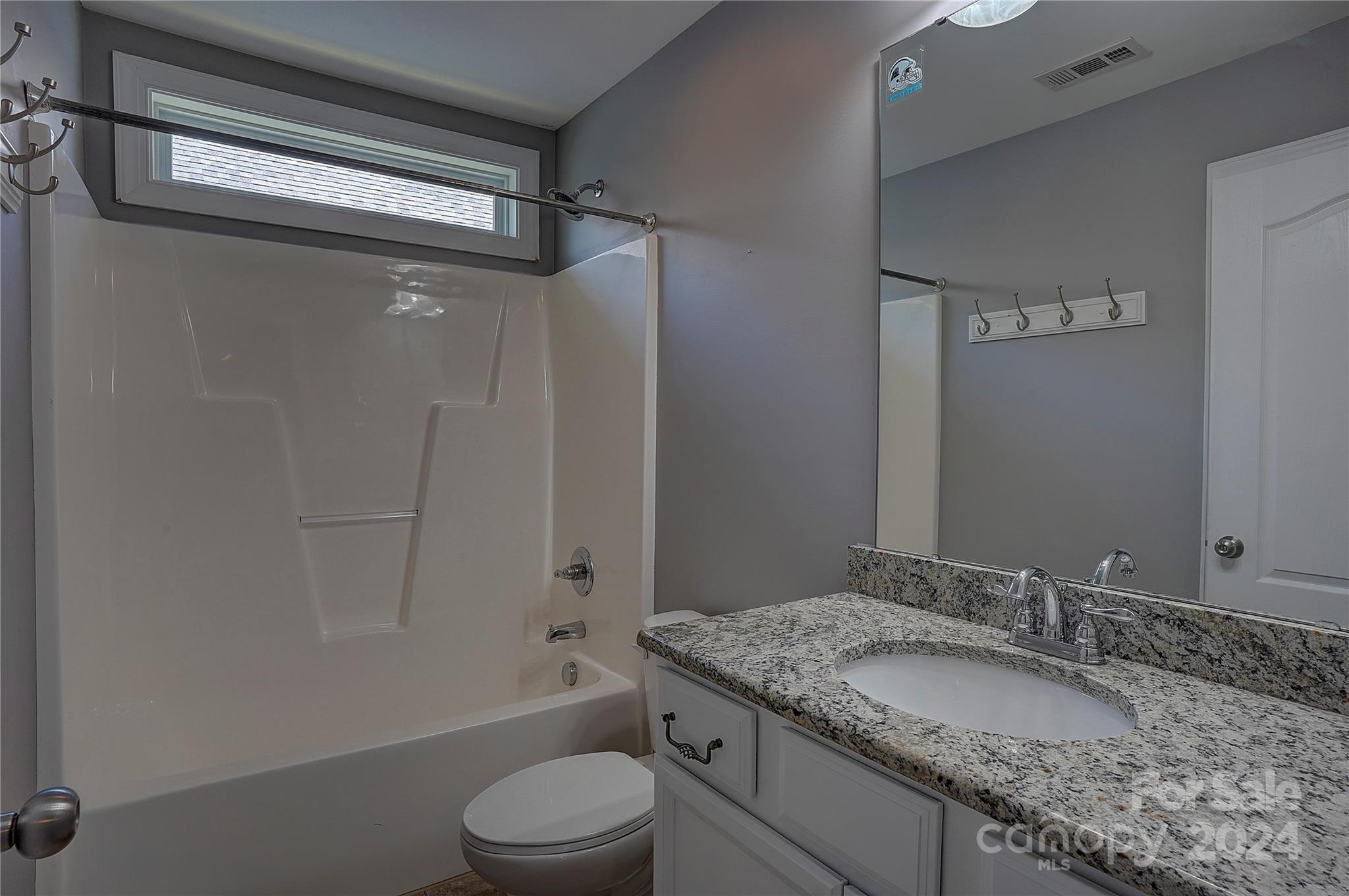 1024 Ridgehaven Road Waxhaw, NC 28173 - Photo 22 of 36 a bathroom with a granite countertop sink toilet and shower