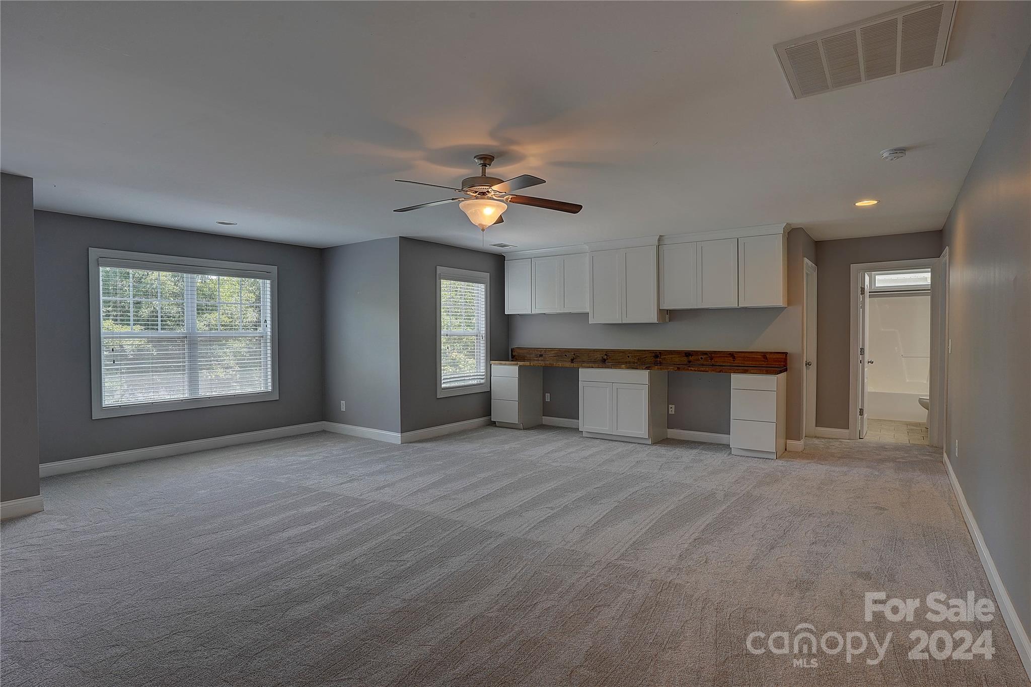 1024 Ridgehaven Road Waxhaw, NC 28173 - Photo 23 of 36 a view of an empty room with window and cabinet