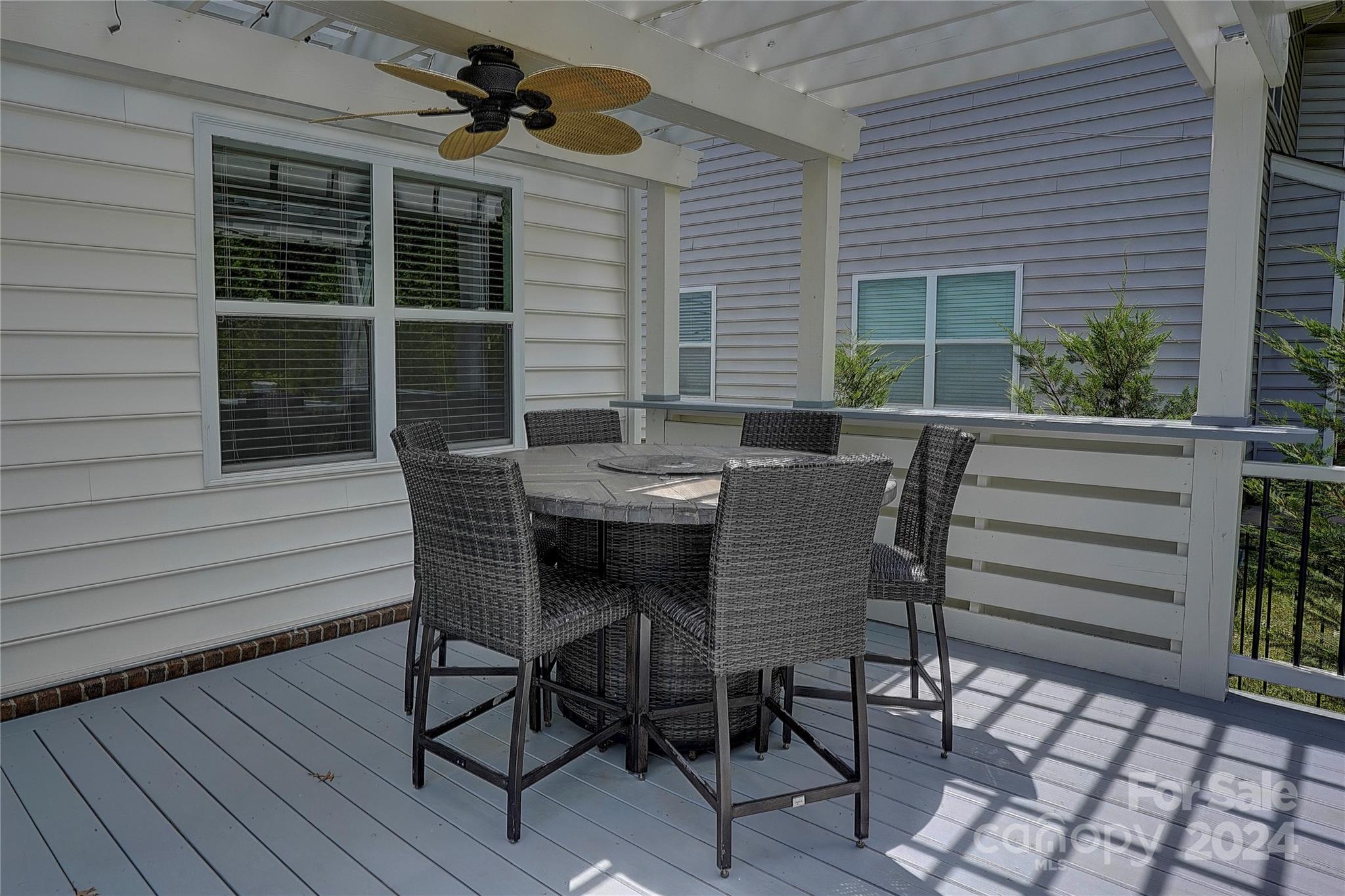 1024 Ridgehaven Road Waxhaw, NC 28173 - Photo 26 of 36 a view of a patio with a table and chairs