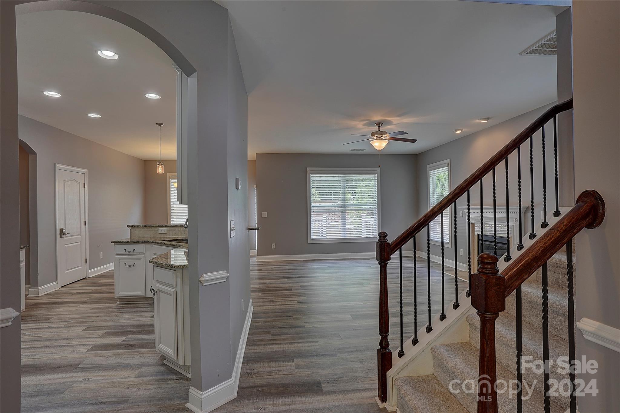 1024 Ridgehaven Road Waxhaw, NC 28173 - Photo 3 of 36 a view of a hallway with wooden floor and staircase