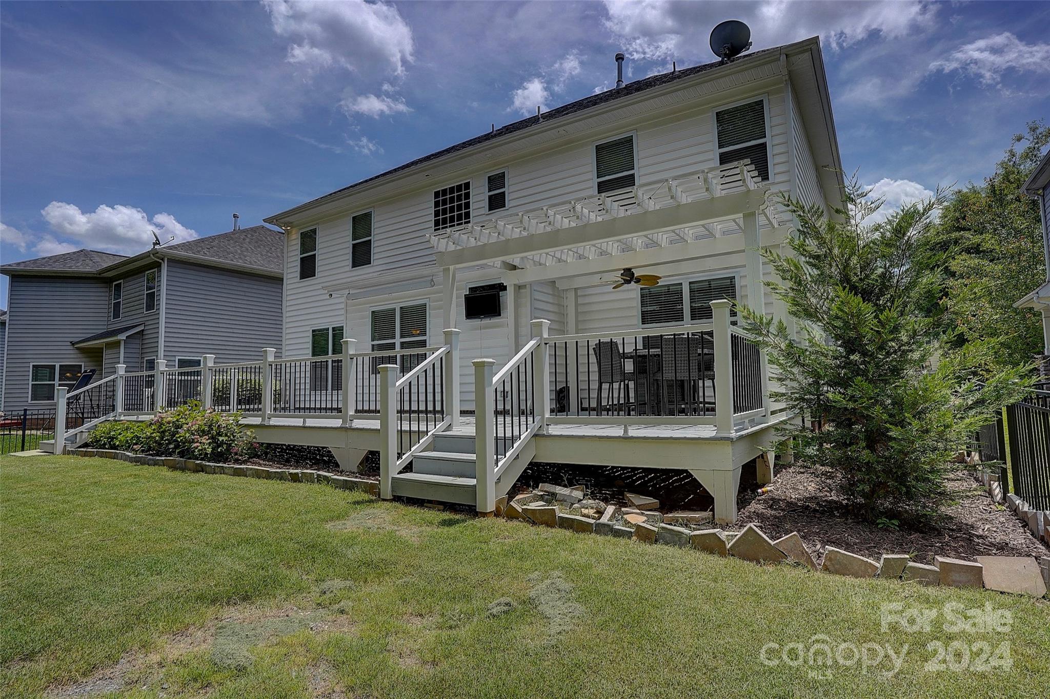 1024 Ridgehaven Road Waxhaw, NC 28173 - Photo 34 of 36 a view of a house with backyard porch and sitting area