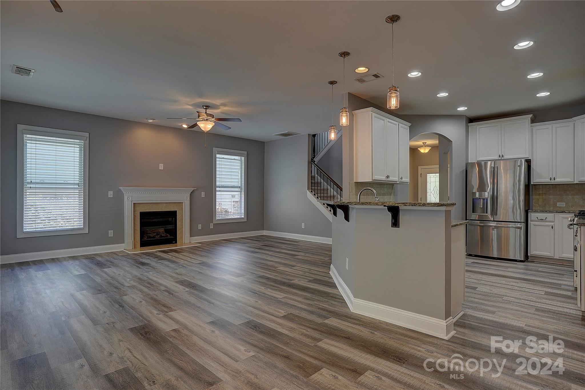 1024 Ridgehaven Road Waxhaw, NC 28173 - Photo 6 of 36 a view of a kitchen with a sink and a fireplace