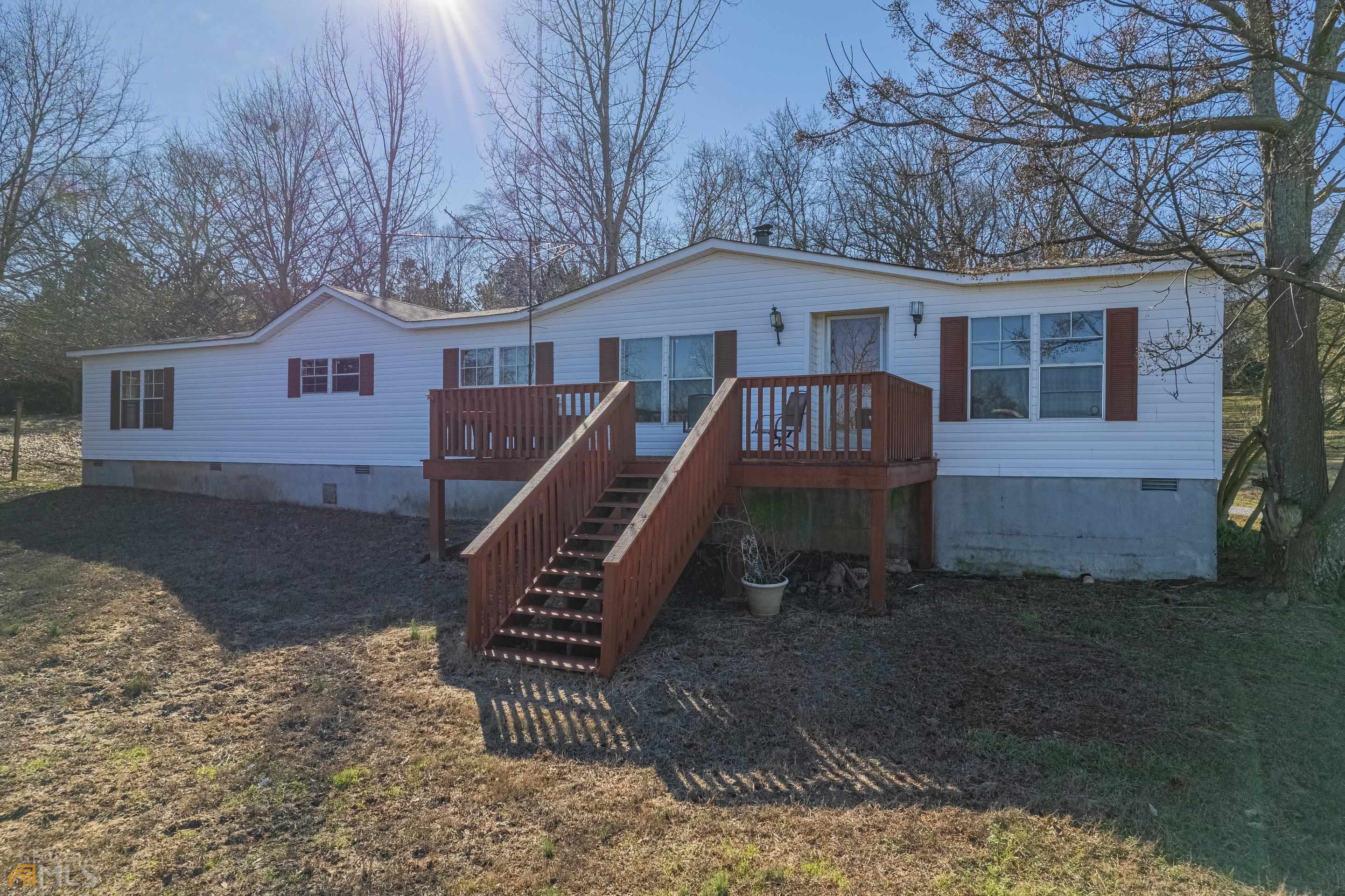 2158 Wildcat Bridge Road Royston, GA 30662 - Photo 1 of 1 a front view of a house with a yard