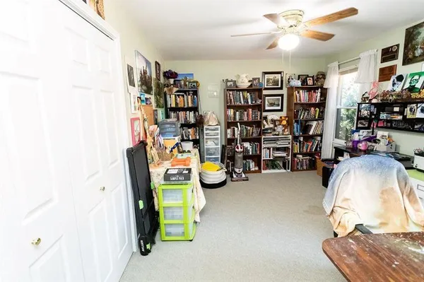 a white toilet sitting next to a bathroom sink