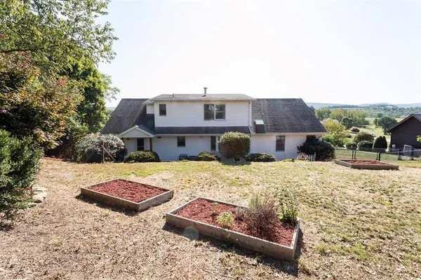 a view of a terrace with wooden fence