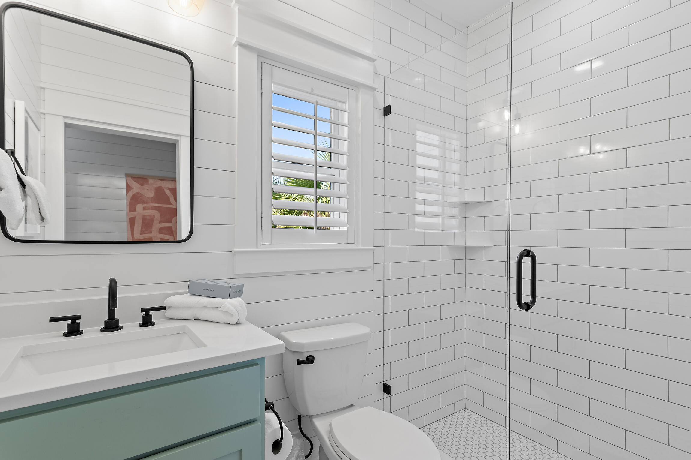 27 Old Mill Road Santa Rosa Beach, FL 32459 - Photo 33 of 43 a bathroom with a sink toilet and mirror