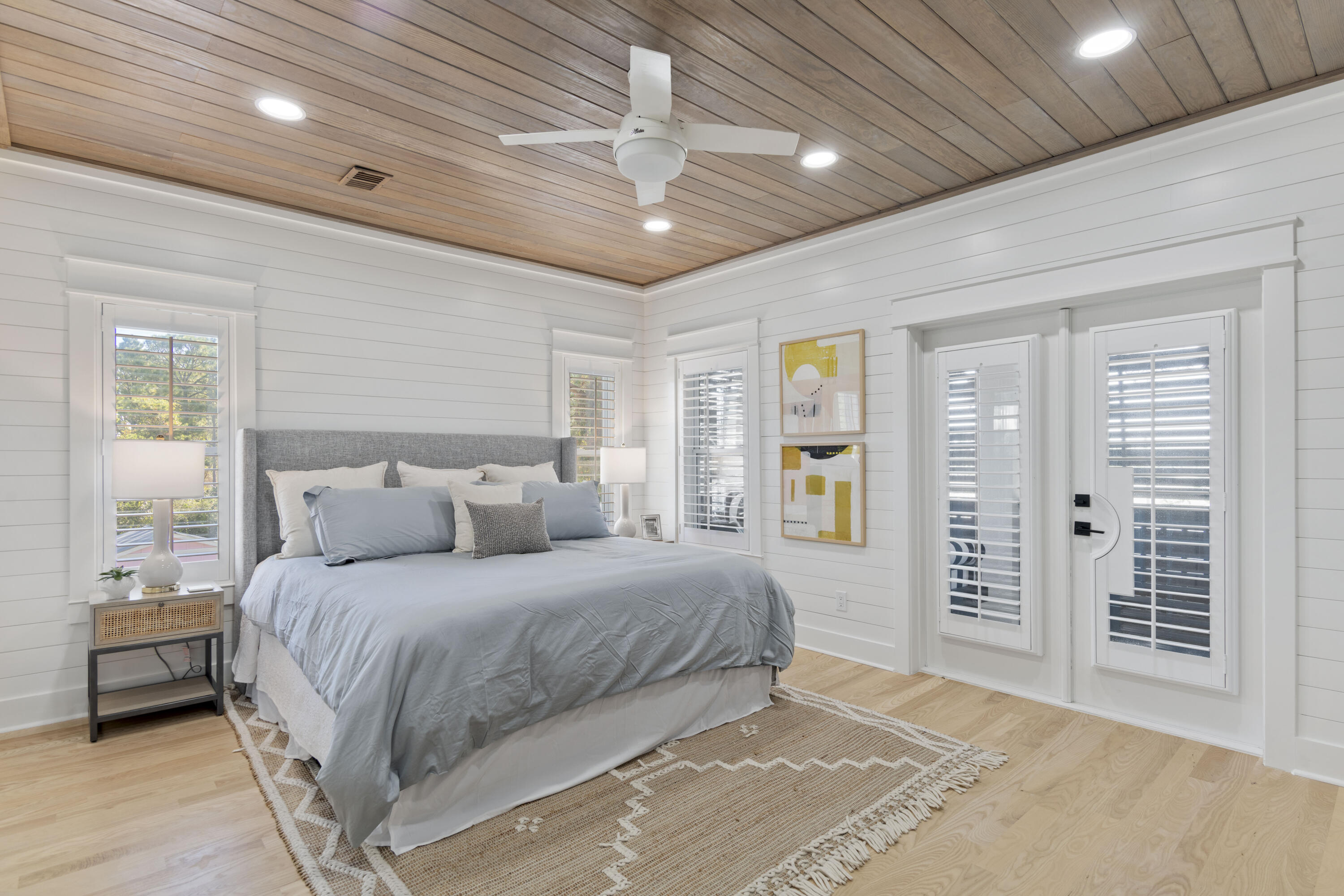 27 Old Mill Road Santa Rosa Beach, FL 32459 - Photo 38 of 43 a bedroom with a large bed and a chandelier