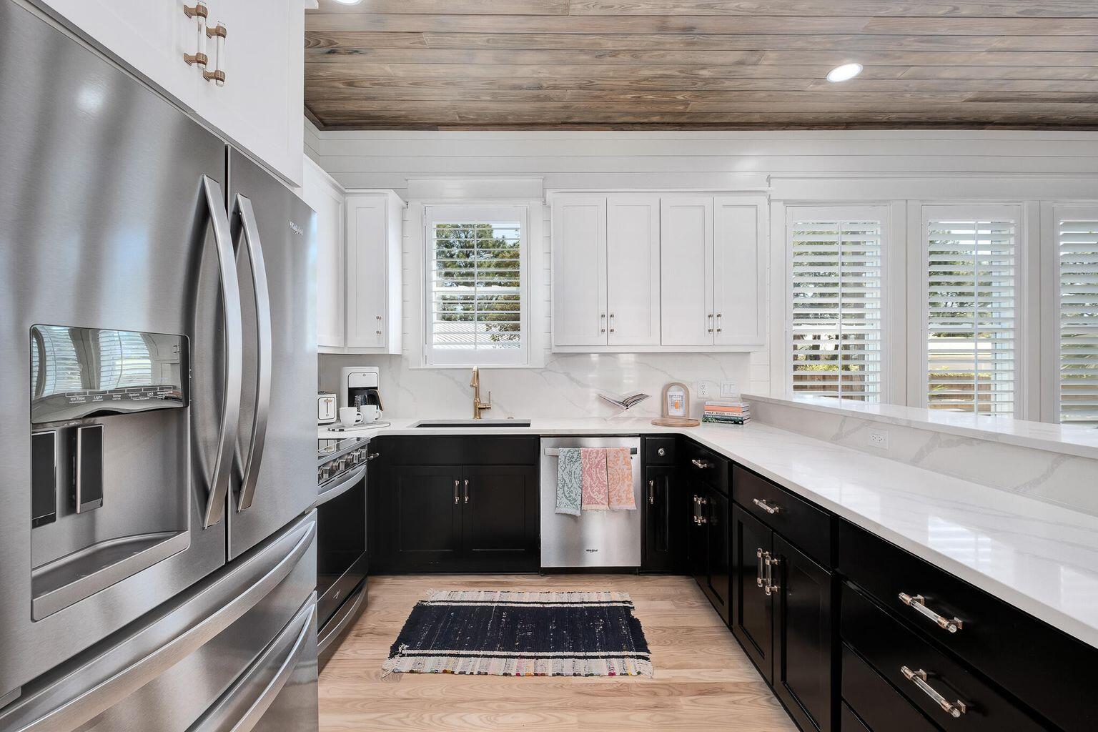 27 Old Mill Road Santa Rosa Beach, FL 32459 - Photo 10 of 43 a kitchen with granite countertop a sink stainless steel appliances and cabinets