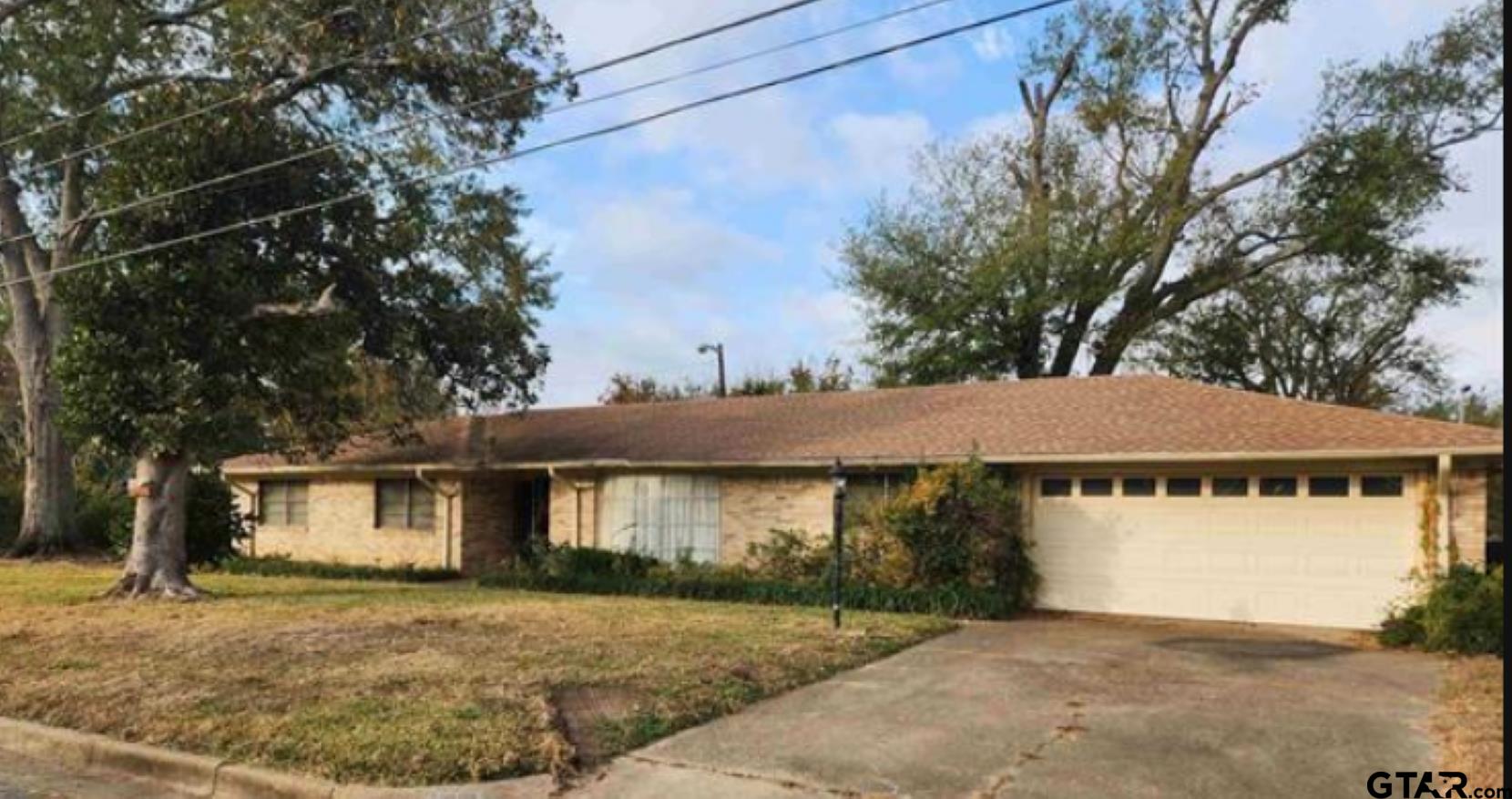 2806 North Glass Avenue Tyler, TX 75702 - Photo 13 of 25 a view of a house with a yard and large tree