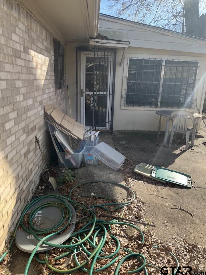 2806 North Glass Avenue Tyler, TX 75702 - Photo 17 of 25 a room with water heater and wooden floor