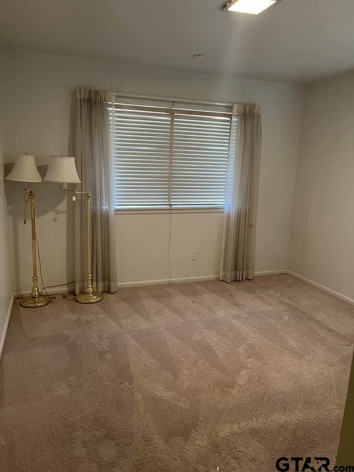 2806 North Glass Avenue Tyler, TX 75702 - Photo 3 of 25 an empty room with windows