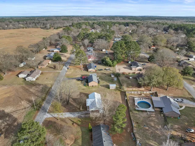 an aerial view of residential houses with outdoor space