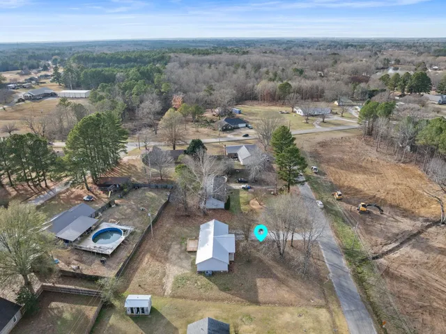 a bathroom with a granite countertop sink a toilet and bathtub