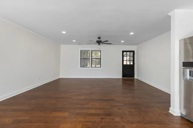 a kitchen with cabinets stainless steel appliances and window
