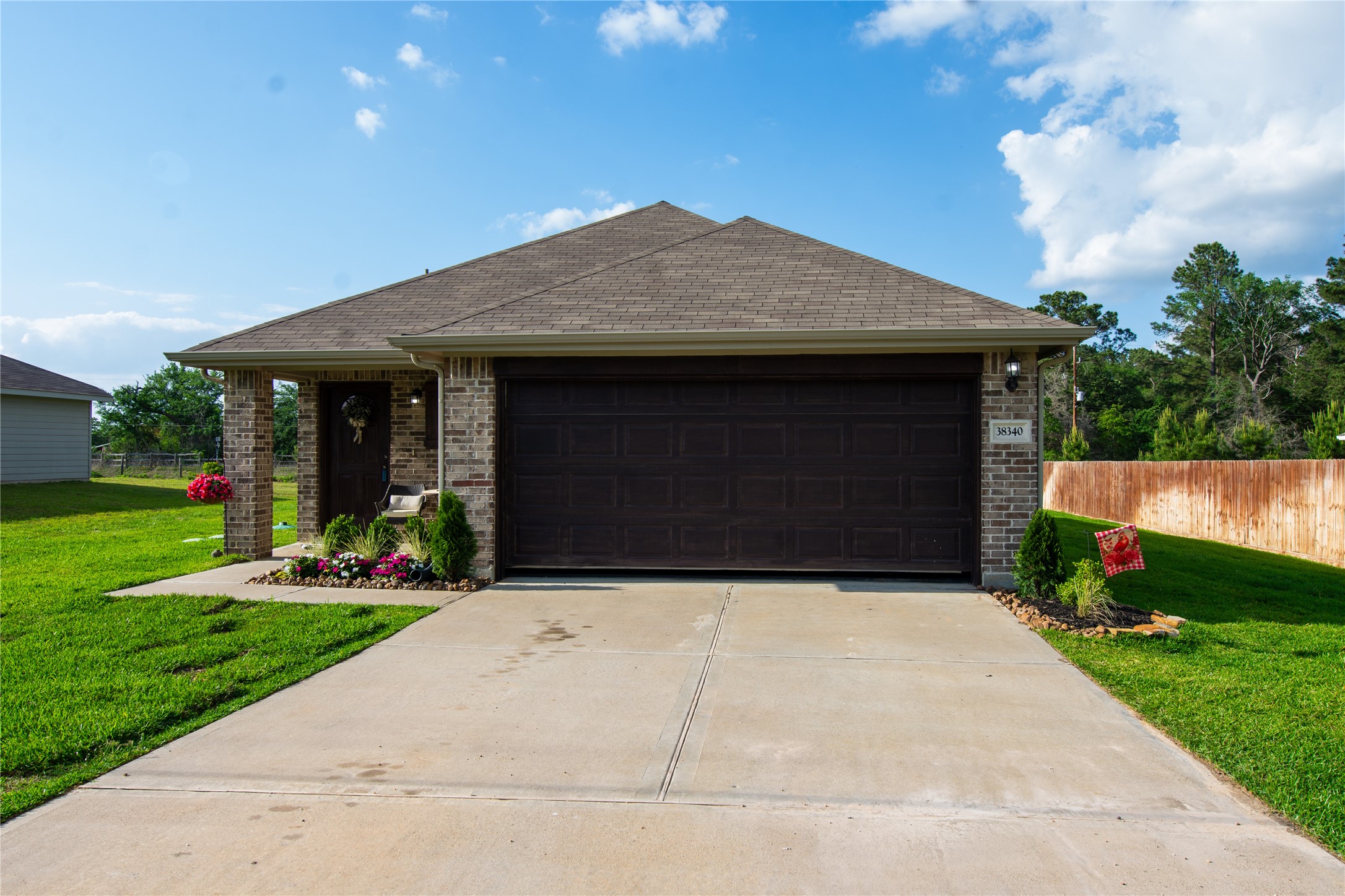 38340 Park View Drive Hempstead, TX 77445 - Photo 1 of 25 a front view of a house with a yard and potted plants