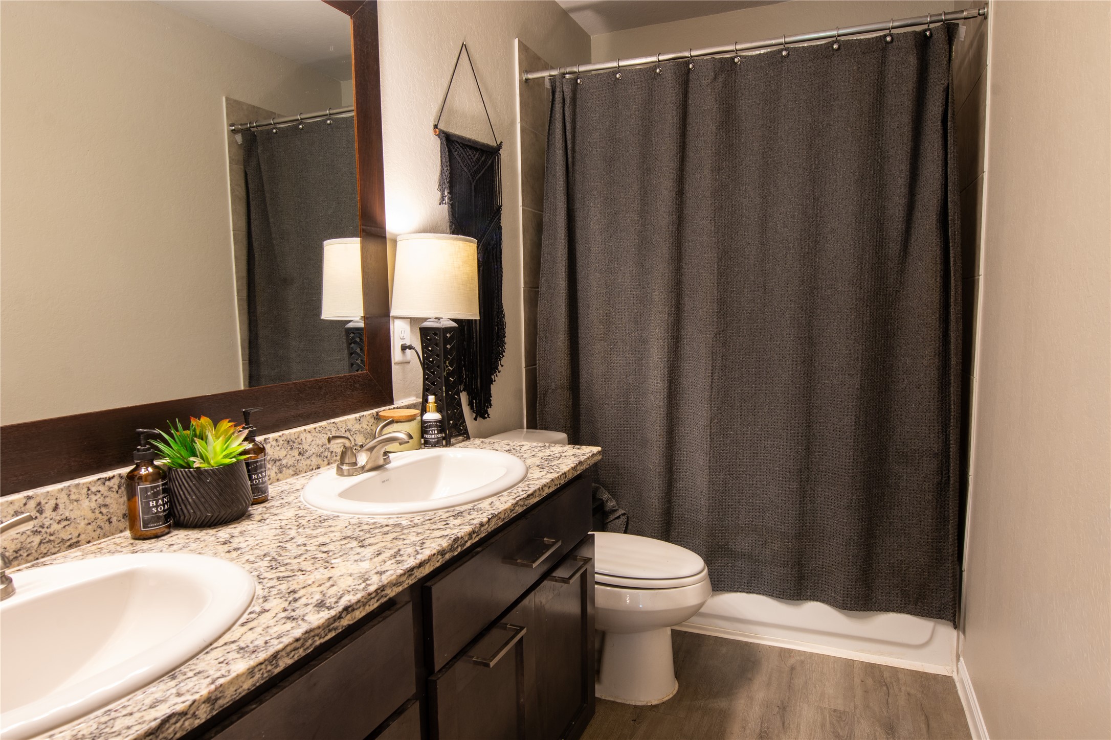38340 Park View Drive Hempstead, TX 77445 - Photo 11 of 25 a bathroom with a granite countertop sink and a mirror